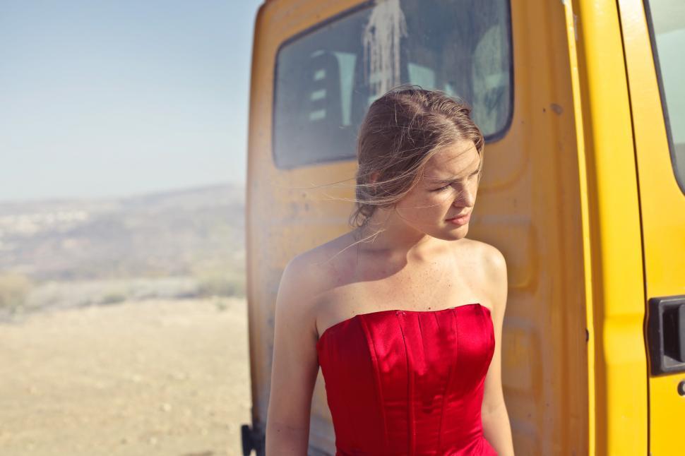 Free Image of Young Adult Woman In Red Party Gown Dress During Outdoor Photosh 