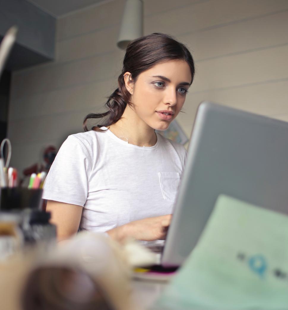 Free Image of A young woman working on her laptop 