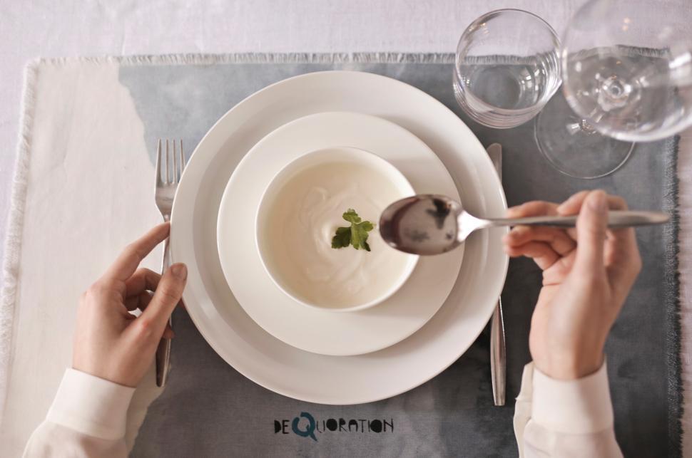 Free Image of A closeup of soup bowl plate and cutlery 