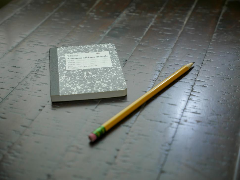 Free Image of composition notebook and pencil 