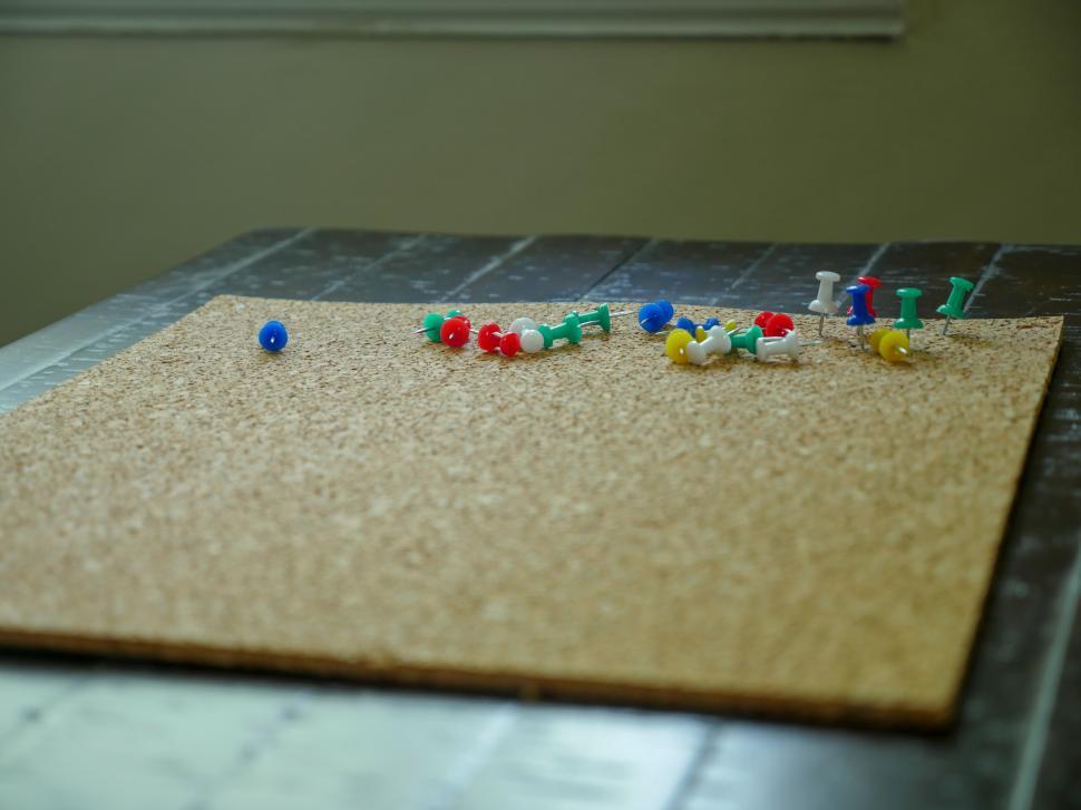 Free Image of push pins on a bulletin board 
