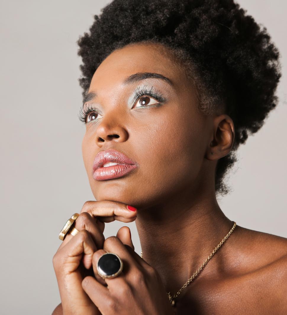 Free Image of A young African woman wearing jewelry posing indoors 