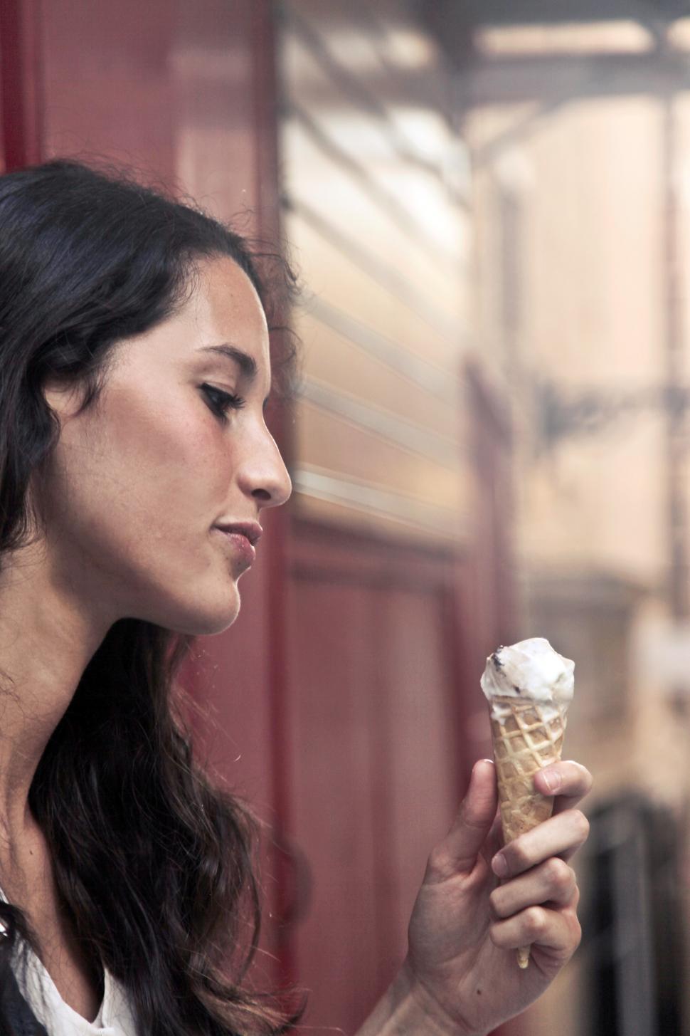 Free Image of A young caucasian woman eating ice cream 