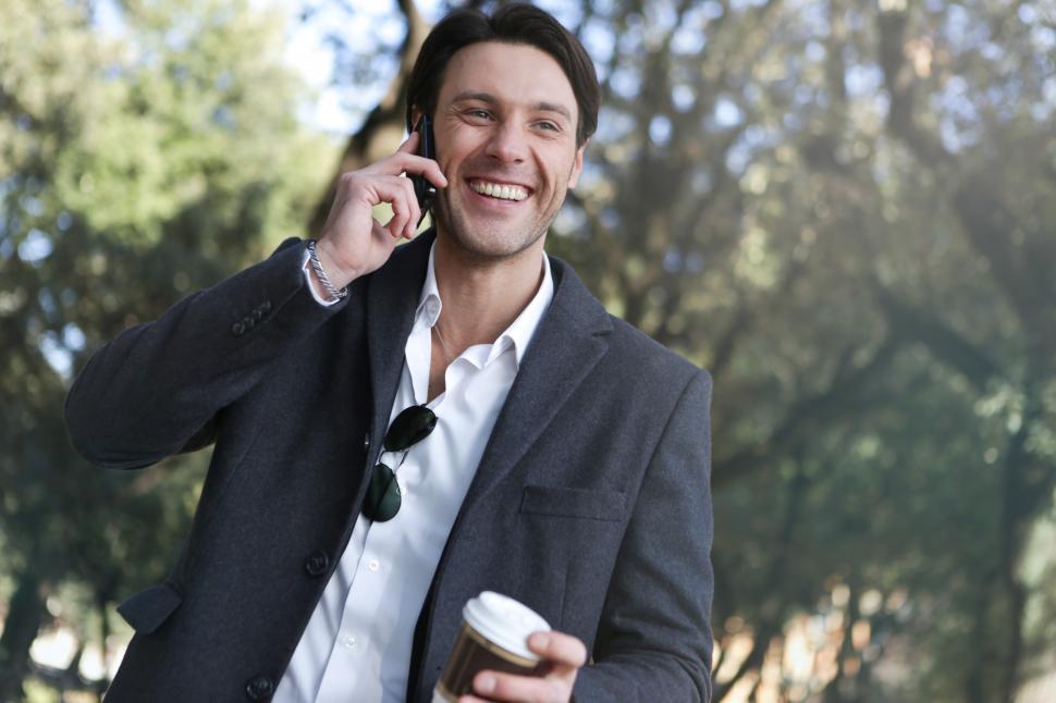 Free Image of A young caucasian man calling on his mobile phone outdoors 