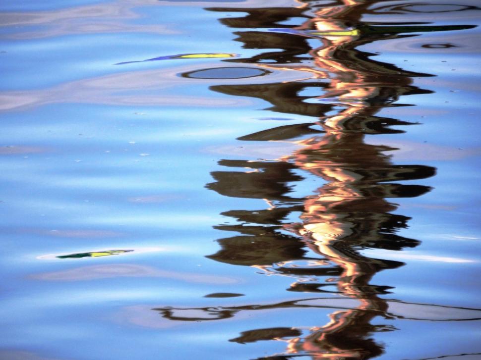 Free Image of Vivid blue abstract wavy water reflection background  