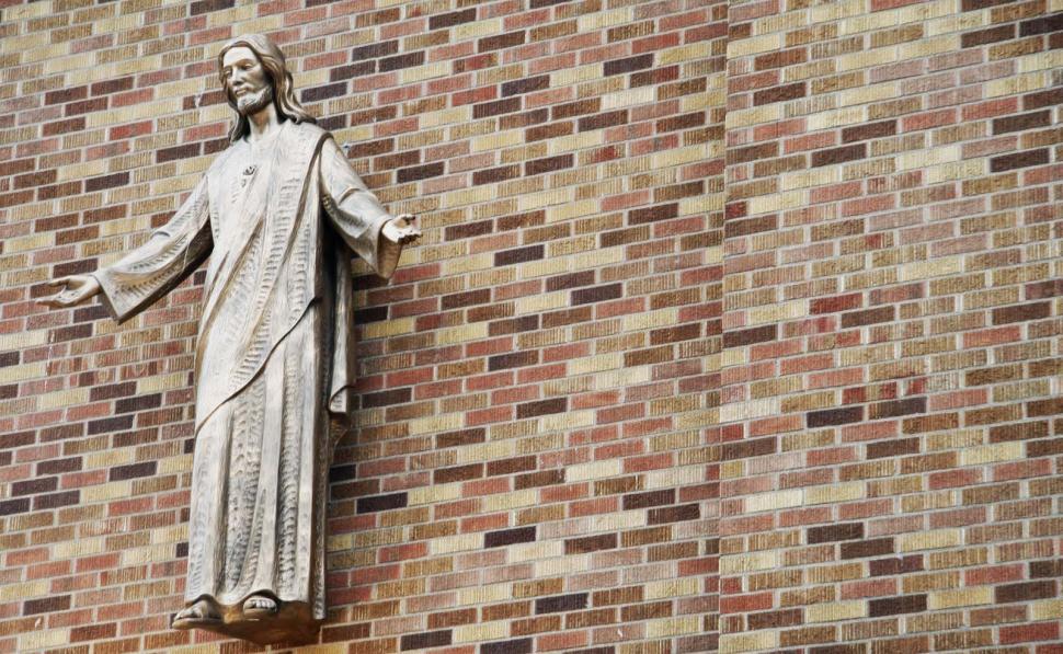 Free Image of Statue of Jesus on a Brick Wall 