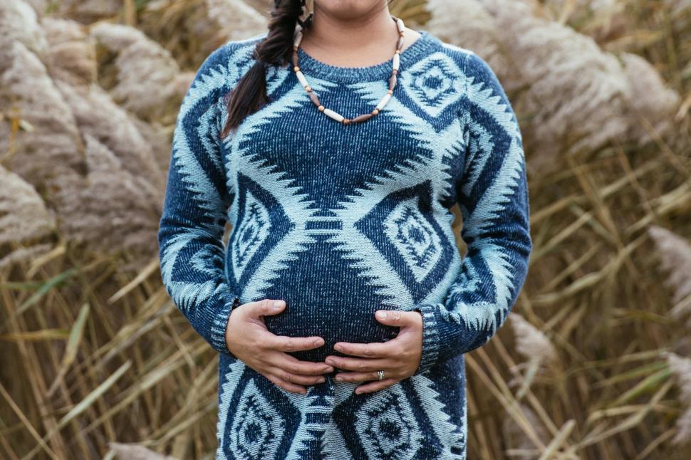 Free Image of A pregnant woman in the field 