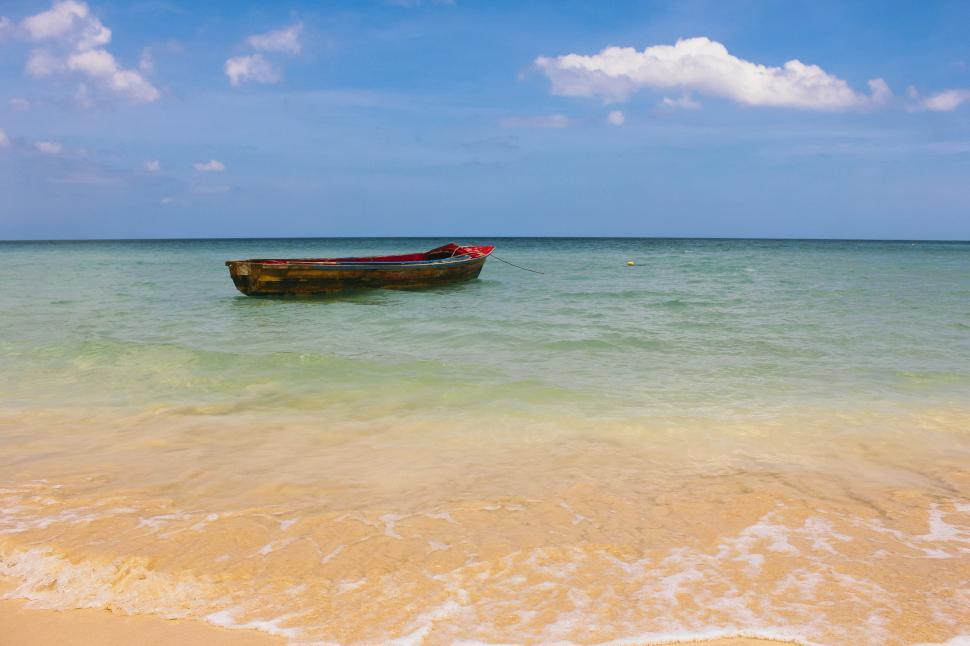 Free Image of A boat in clear blue ocean 