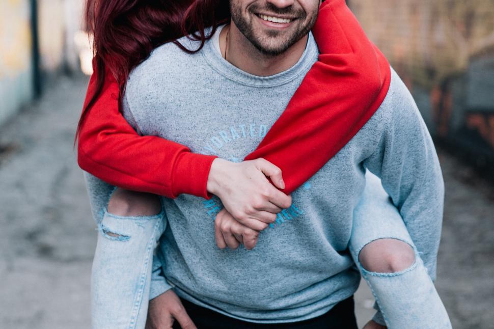 Free Image of A young caucasian couple piggyback 