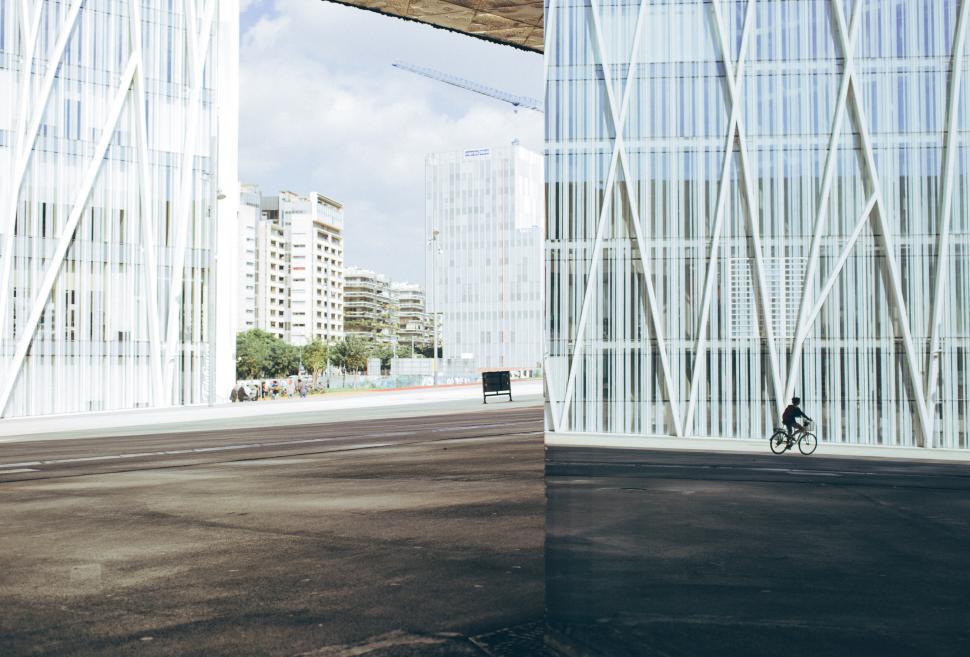 Free Image of Cycling down a modern building block 