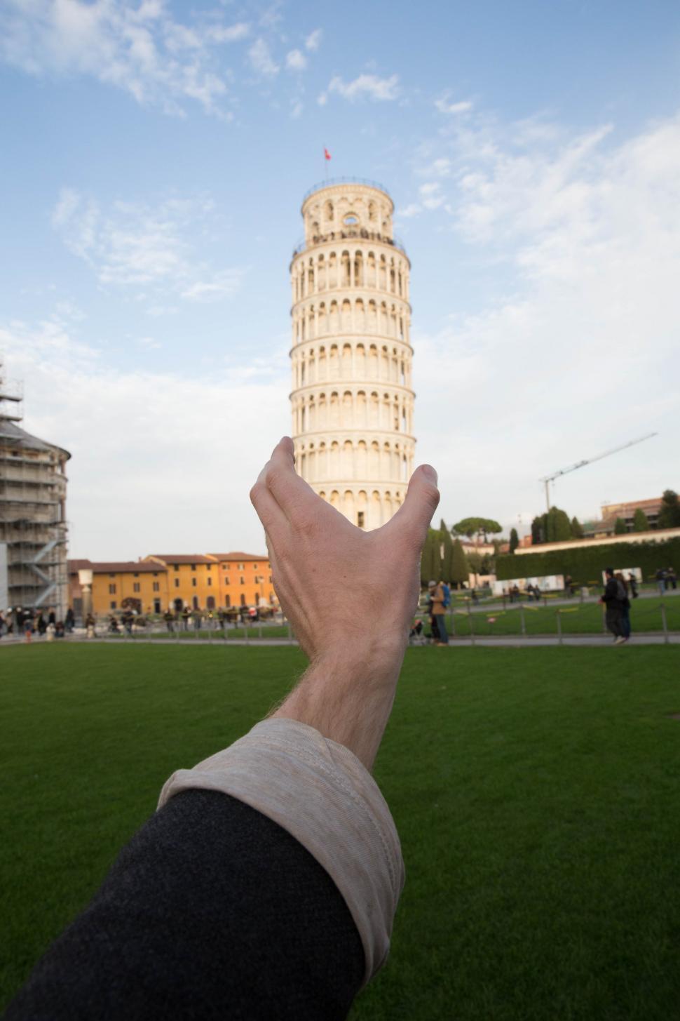 Free Image of Leaning tower of Pisa, Italy held by a hand 