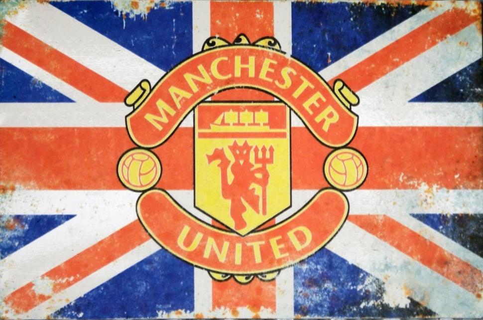 Free Image of Vintage aged Union Jack advertising sign board for Manchester United Football Club  