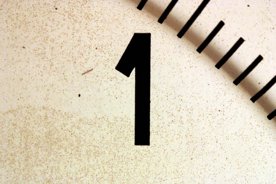 Free Image of Close Up of Clock Showing Number One 