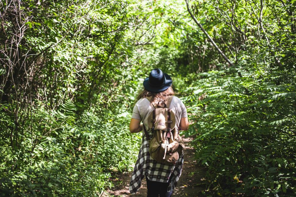 Free Image of A female hiker walking in the forest 