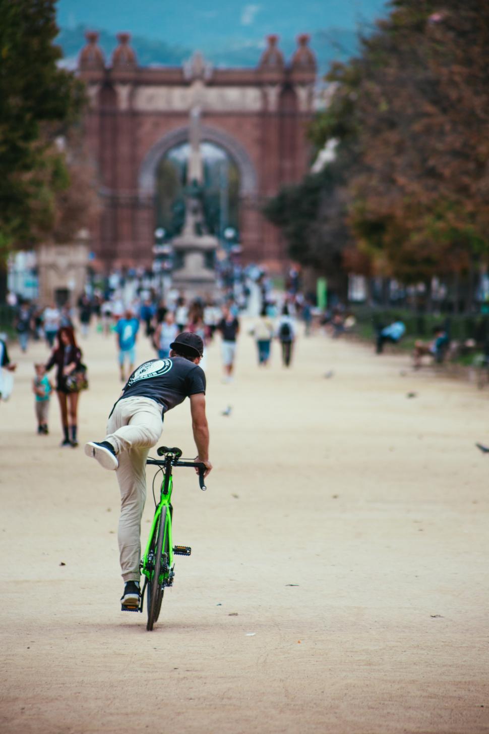 Free Image of A young Caucasian man cycling in a park 