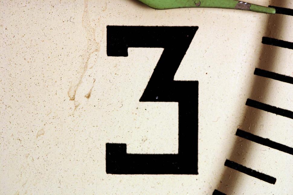 Free Image of Close Up of Clock Showing Number Five 