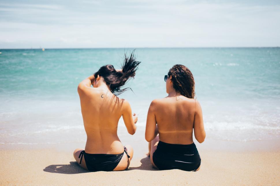 Free Image of Two caucasian women sunbathing on the beach 