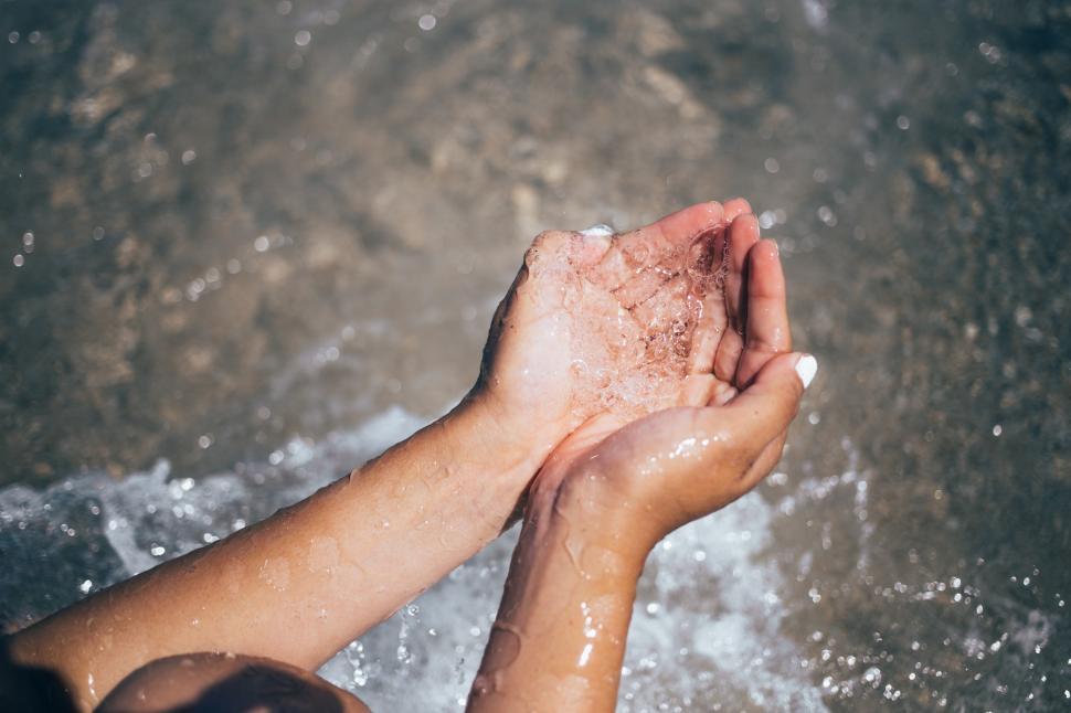 Download Free Stock Photo of Carrying water in hands 