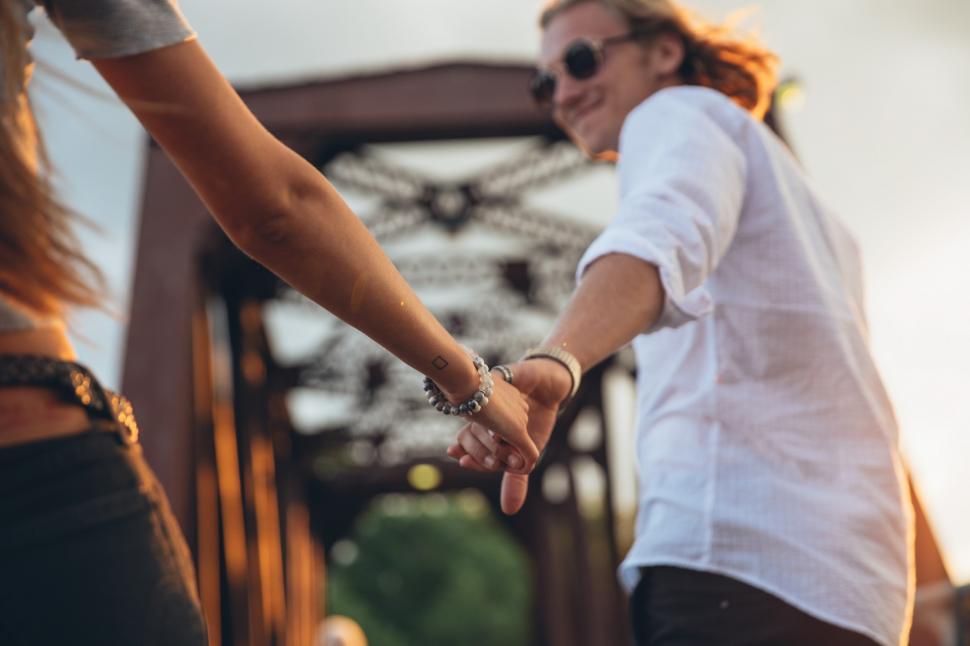 Free Image of A caucasian couple holding each others hands 