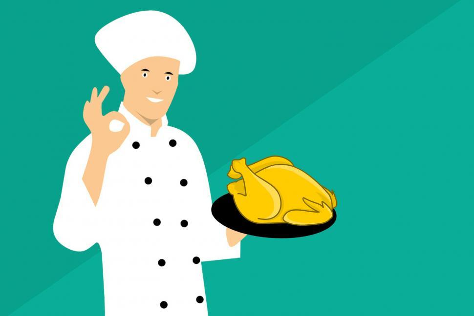 Free Image of chef showing chicken  