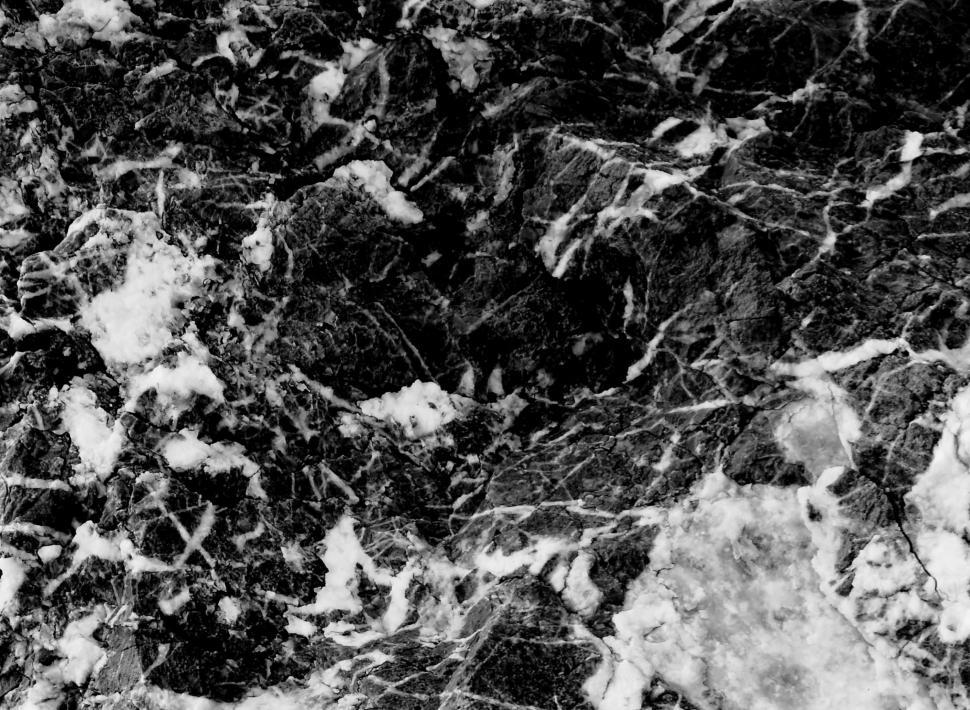 Free Image of Contrasting black and white cracked marble rock texture.  