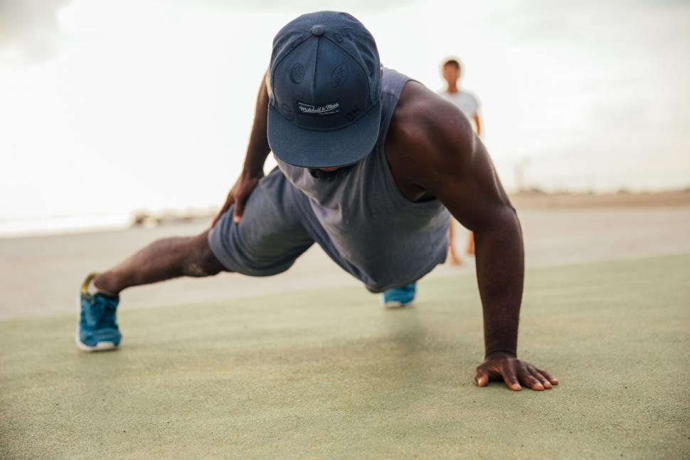 Free Image of One armed push-up exercise by a young african man 