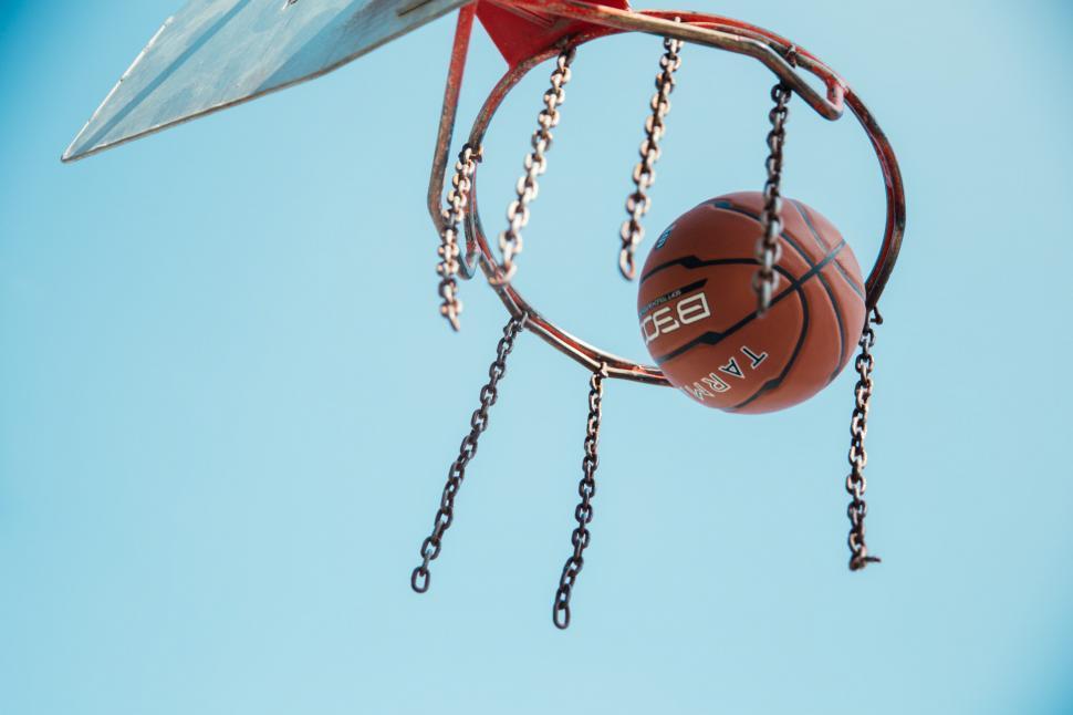 Free Image of Basketball in basketball net 