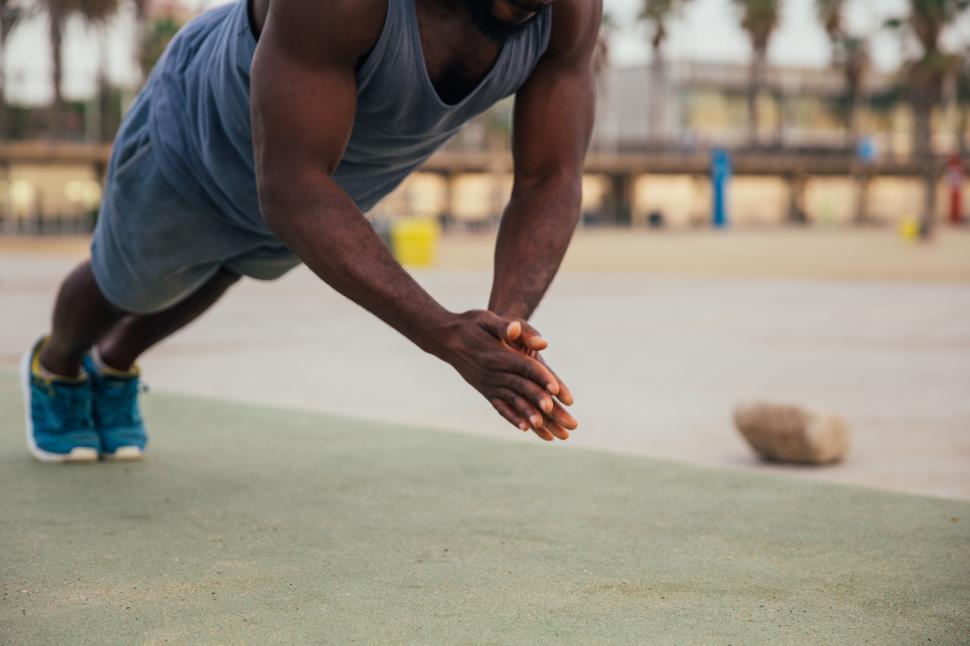 Free Image of Clapping push-up exercise by a young african man 