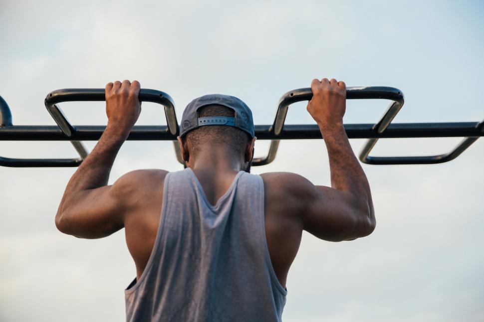 Free Image of A young african man doing chin-up exercise 