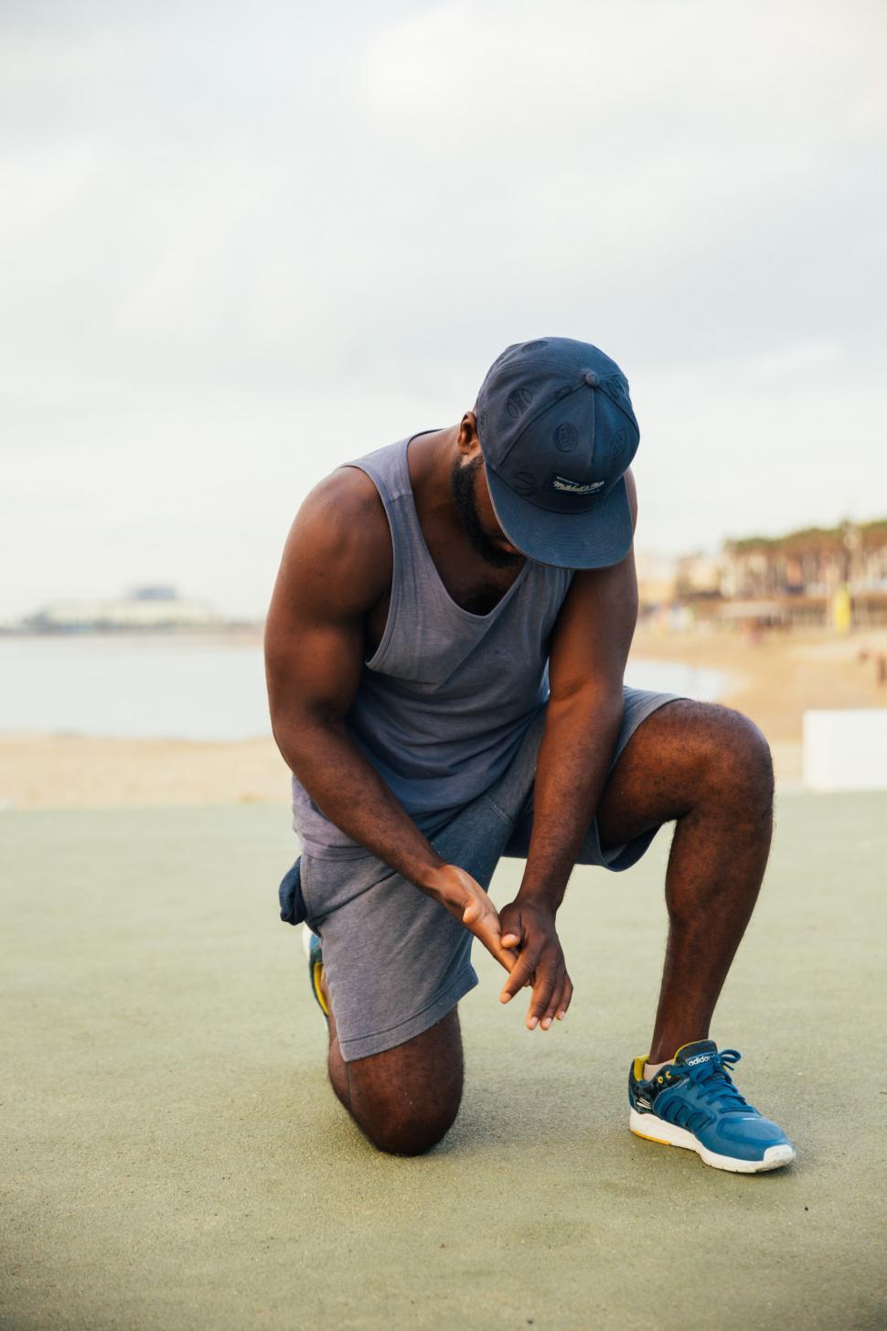 Free Image of A young African man doing kneeling-workout outdoors 