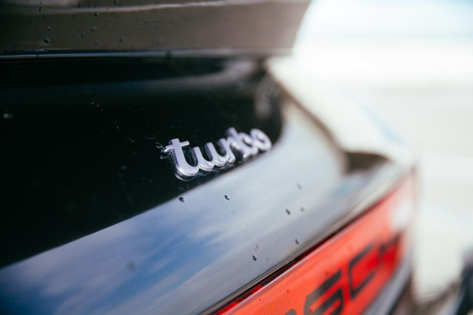 Free Image of Turbo detail on a black sports car 