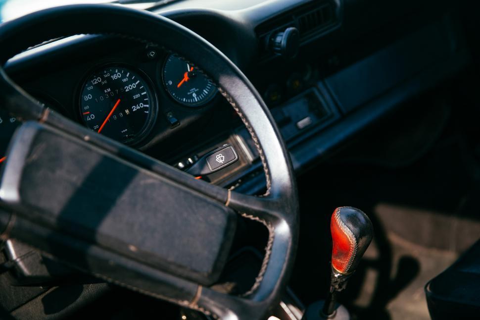 Free Image of Interior of a car with speedometer in the background 