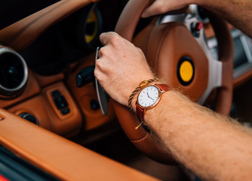 Free Image of Interior of a car with focus on driver s wrist watch 