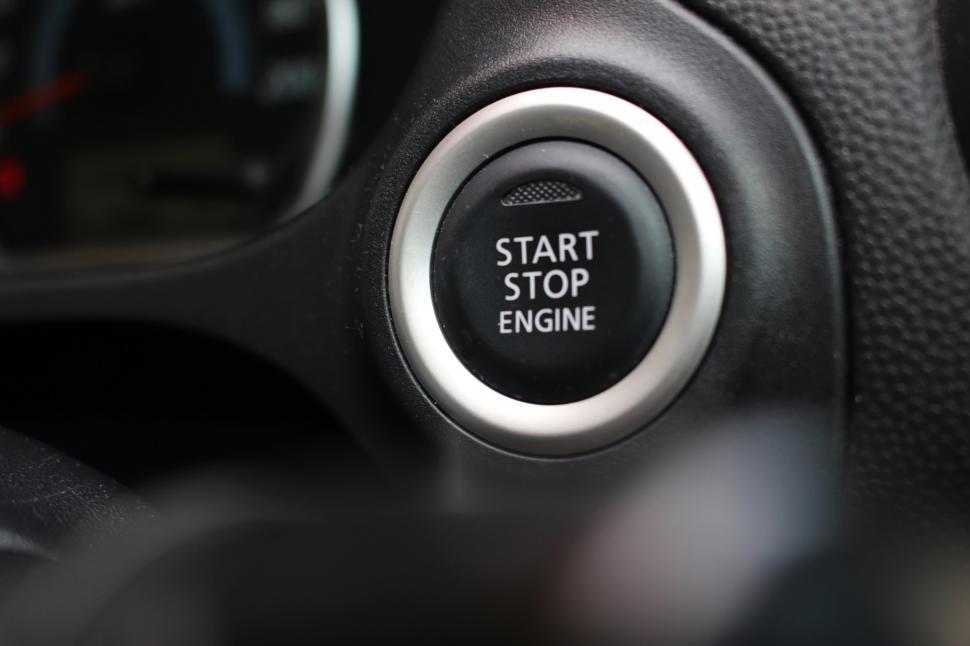 Free Image of The start stop engine button of a modern car's dashboard  