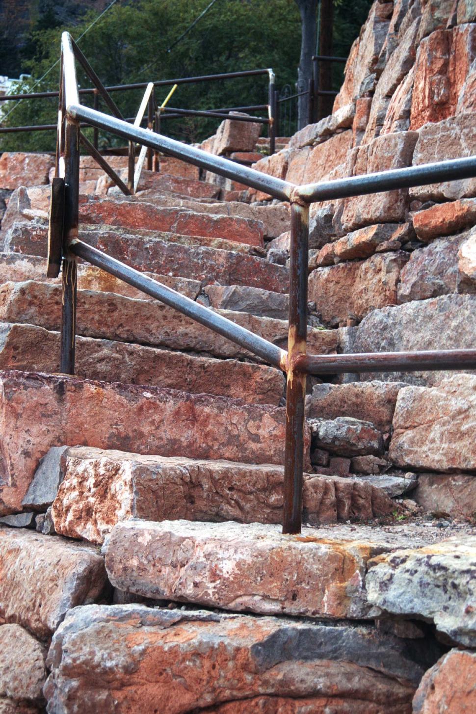 Free Image of Stone steps with metal handrail 