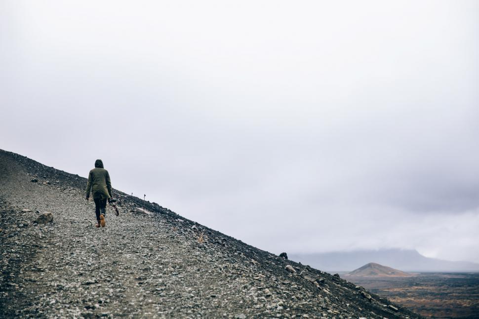 Free Image of A hiker on a gravel hill 