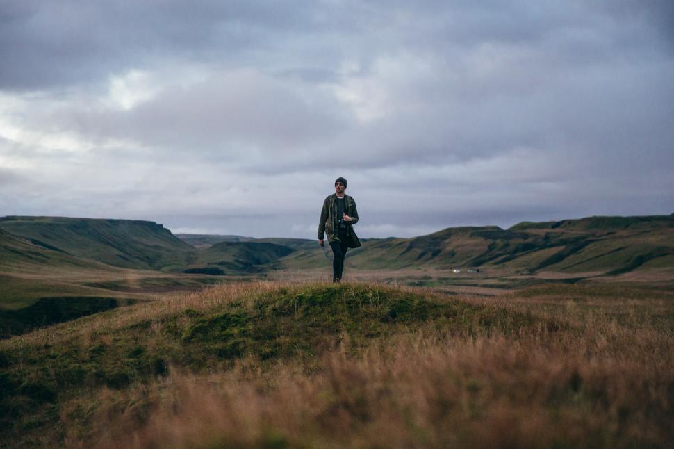 Free Image of A hiker in rocky Iceland field 