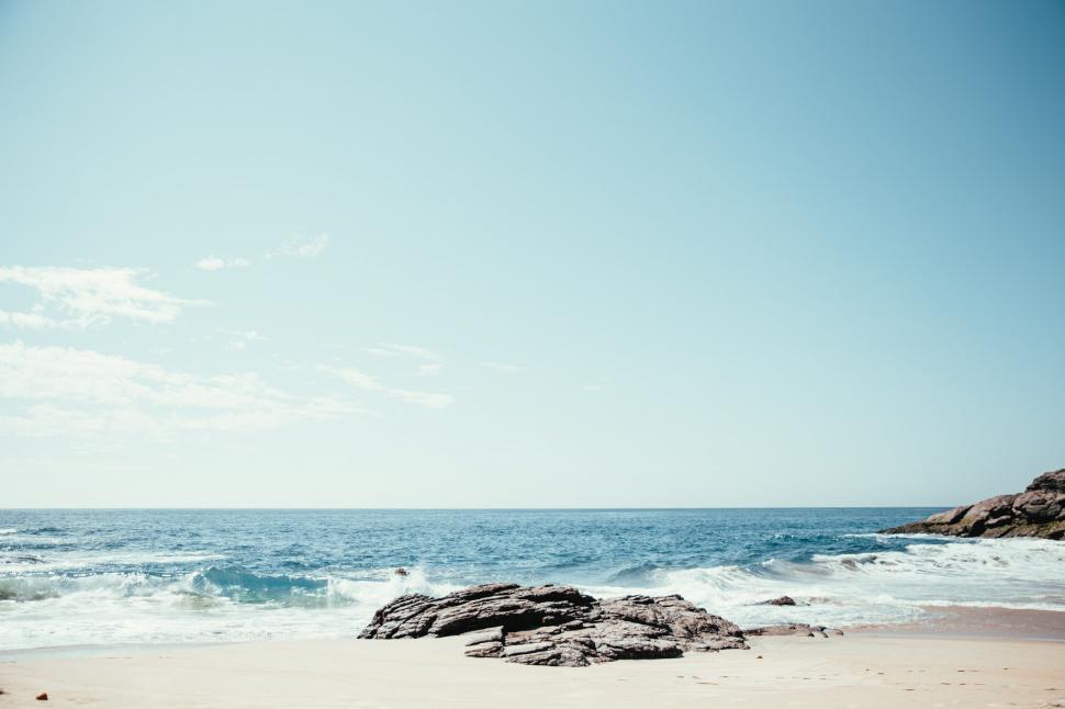 Download Free Stock Photo of A rocky beach in sunlight 