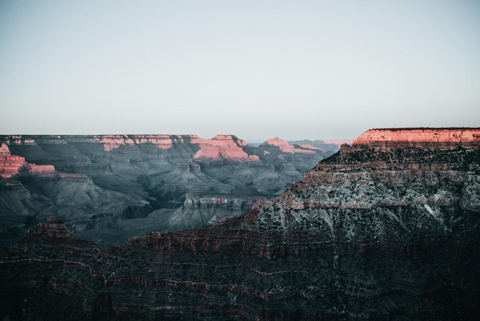 Free Image of Sunrise over Canyon peaks 