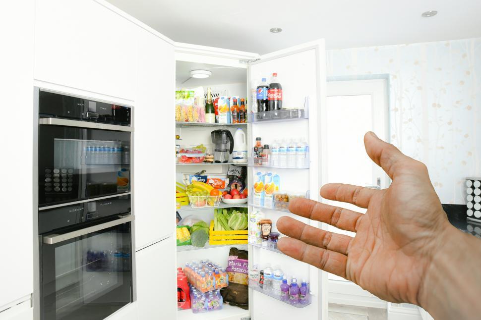 Free Image of hand pointing to fridge  