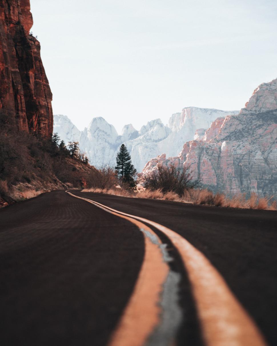 Free Image of A curvy canyon highway in the day time 