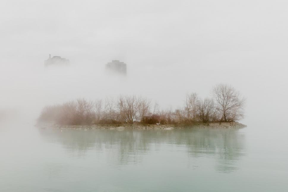 Free Image of A fog covered city waterside 