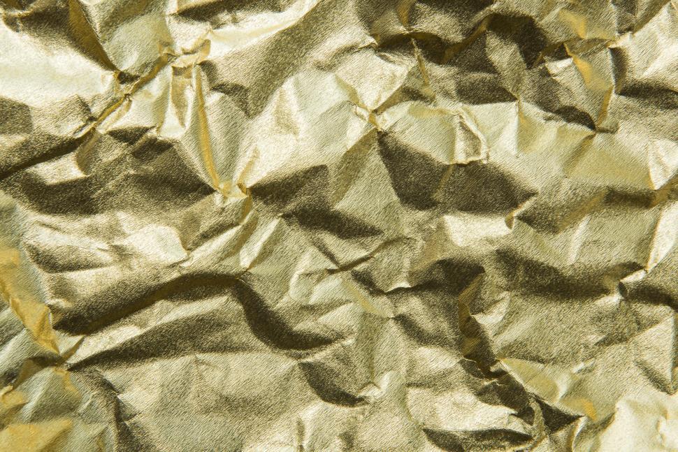Free Image of abstract texture of gold wrinkled paper 