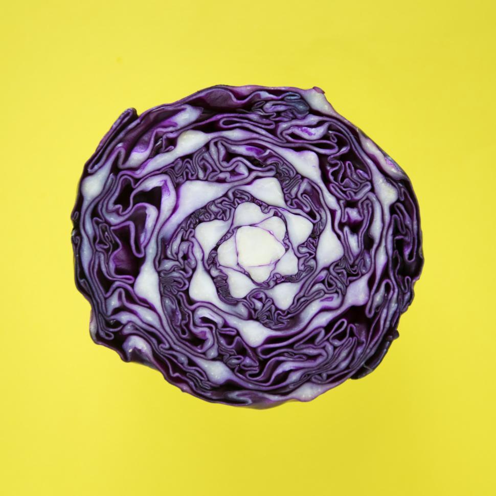 Free Image of Flat layer of purple cabbage on yellow surface 