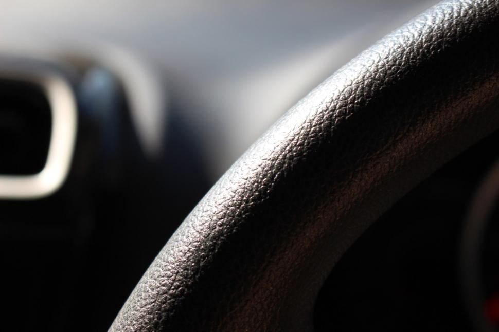 Free Image of Abstract detail of a car steering wheel  