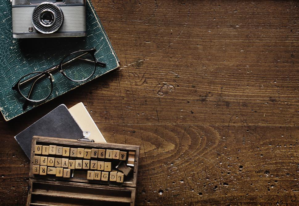 Free Image of Vintage camera and spectacles on a weathered woode 