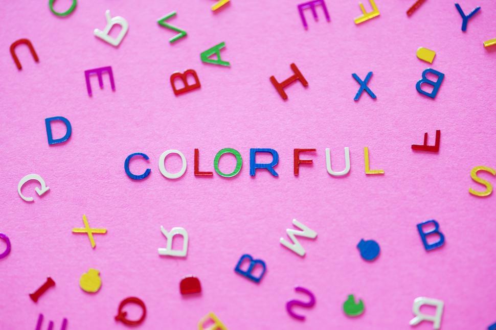 Free Image of Flat lay of the word COLORFUL arranged with plastic alphabet blo 
