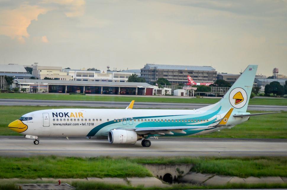 Free Image of Painted Plane taxi on runway  