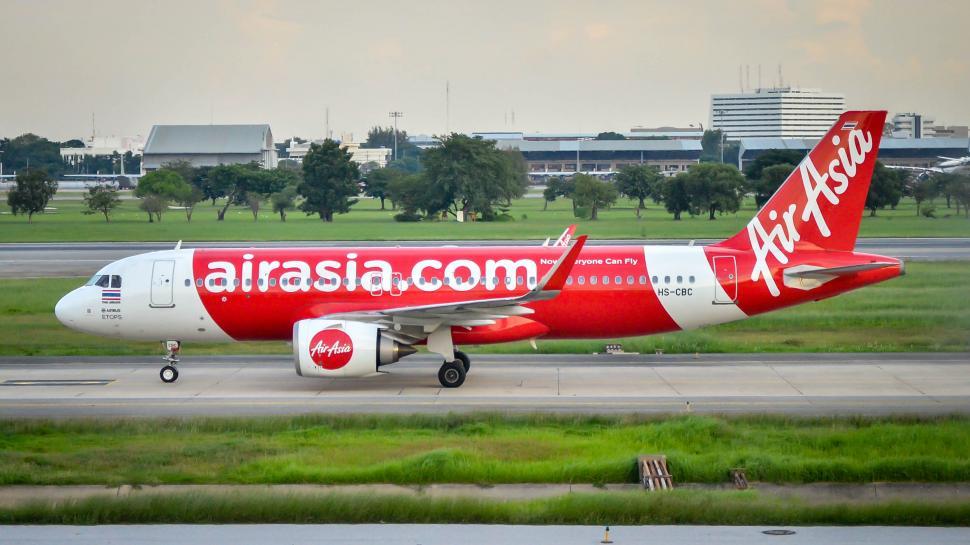 Free Image of Red Plane taxi on runway  