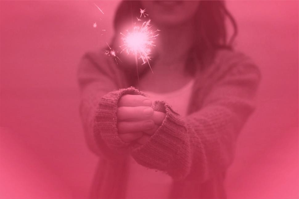 Free Image of Girl Holding Sparkler - Happiness and Joy Concept  
